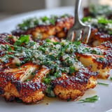 Vibrant BBQ Cauliflower Steaks topped with fresh, herbaceous chimichurri, perfect for a summer grill.