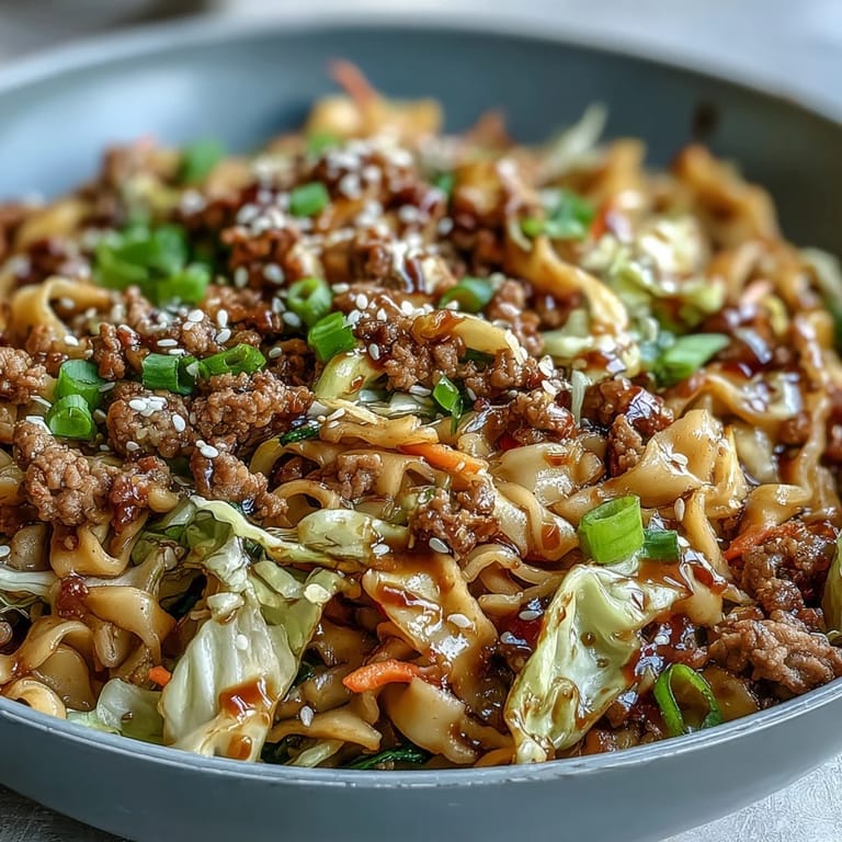 Colorful Egg Roll in a Bowl served in a skillet, showcasing savory meat and fresh vegetables in a low-carb Asian-inspired dish.  