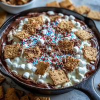Gooey 4th of July S'mores Dip in cast iron, ready for dipping.